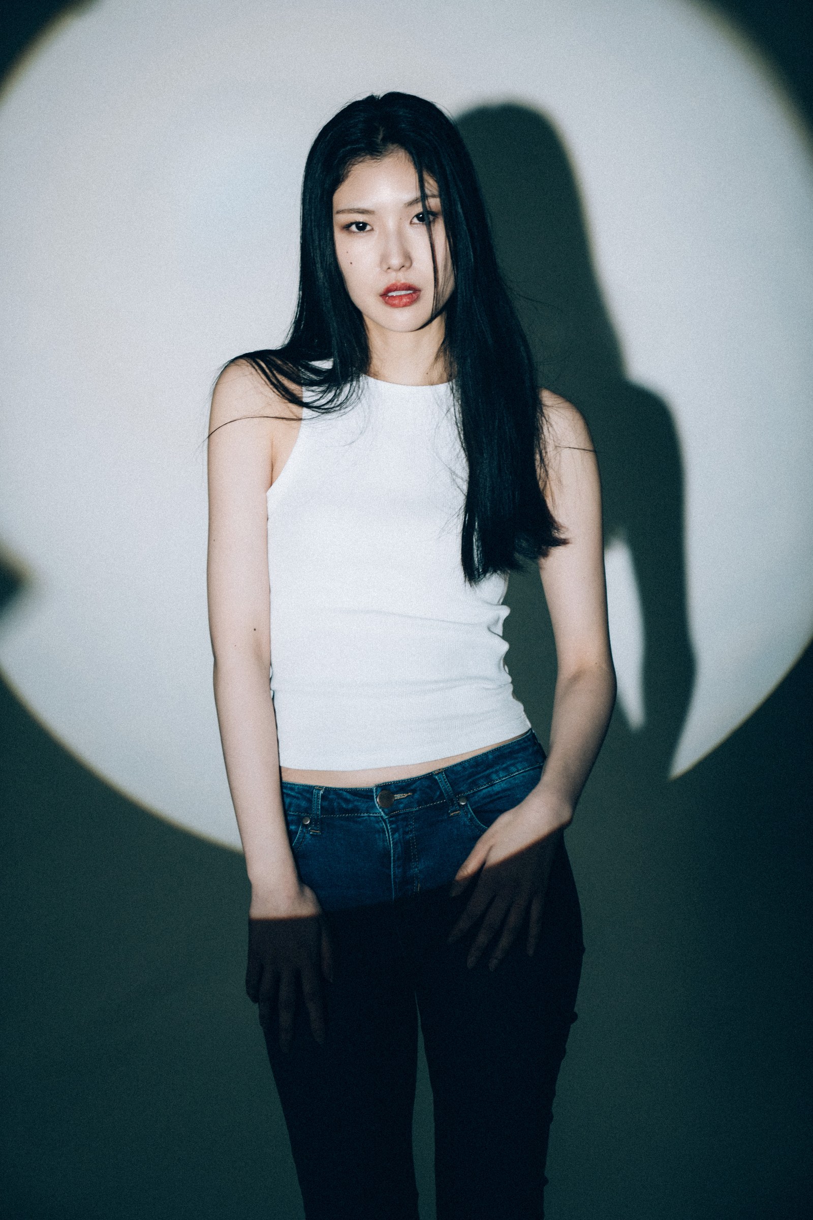 Model Kana photographed in circular spotlight by Eddie Huynh